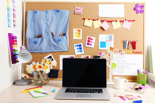 A cork board full of inspirational messages.