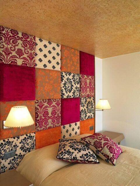 A bedroom wall decorated with fabric.