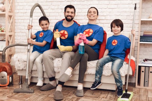 A family of four with good mental health getting ready to clean their home.