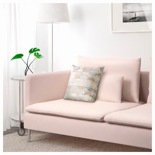 A light-pink couch in a living room.