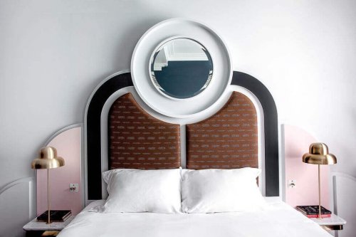 Art deco headboard with a round mirror