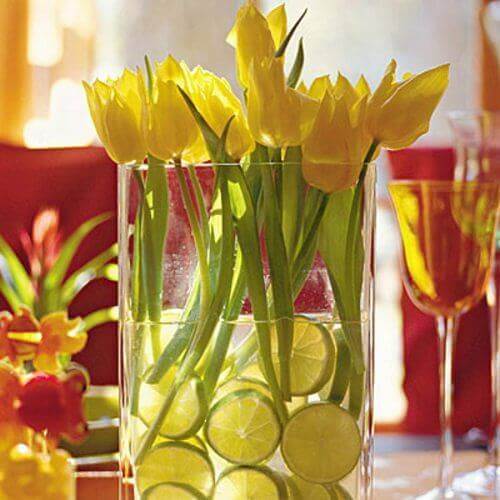 A centerpiece with tulips and lemons.
