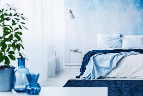 A bedroom featuring different tones of blue.