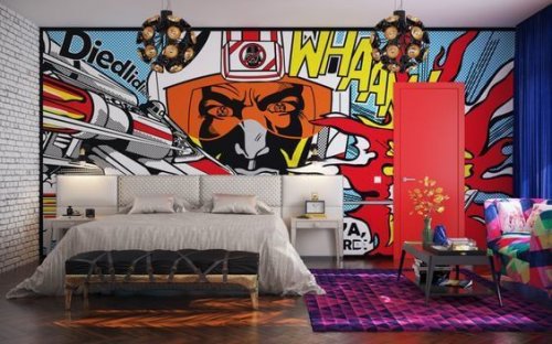 Bedroom with a bold mural painted on the wall.