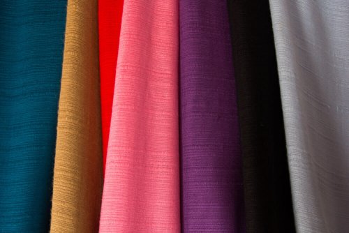An assortment of different colored fabrics