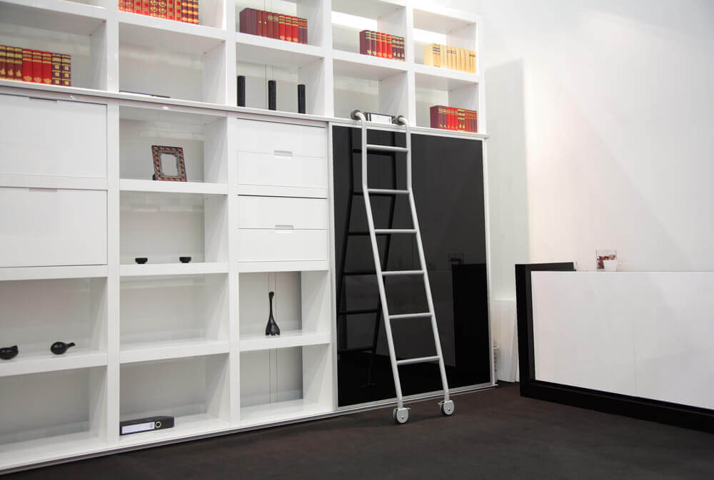A square bookshelf with a ladder.