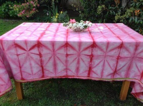 Pink and red tie-dyed table cloth