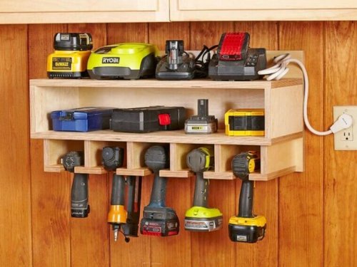 Tools organized in a wooden shelf.