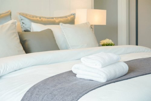 White towels on a bed.