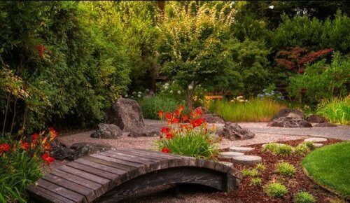 A lovely wooden garden bridge.