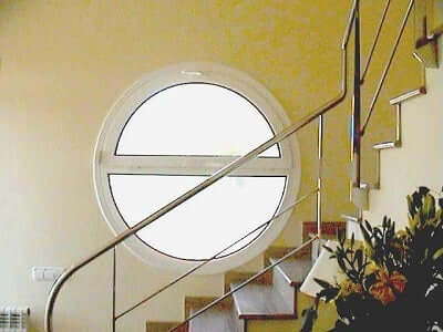 A staircase with a metallic rail.