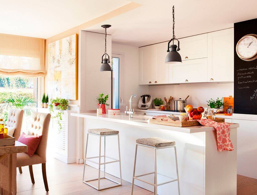 A bright kitchen with stool seating.