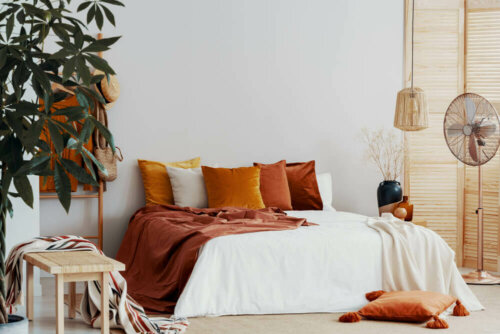 A bedroom with orange hues.
