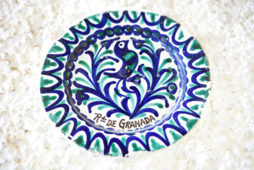 A decorative plate with a bird.