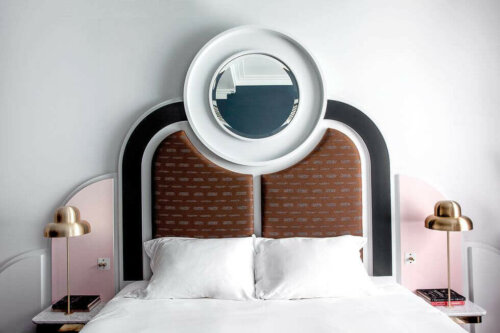 Art deco style bed with a mirror on the headboard