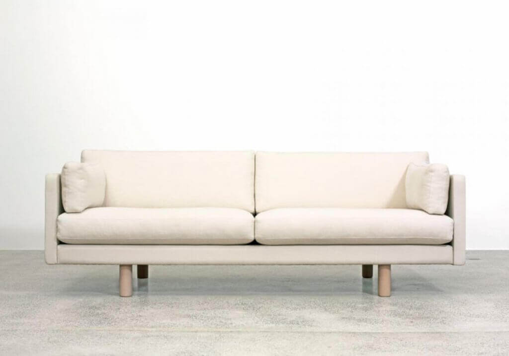 A white couch in a room.