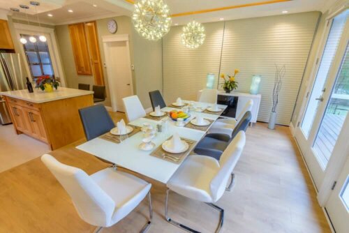 A gray and white dining room.