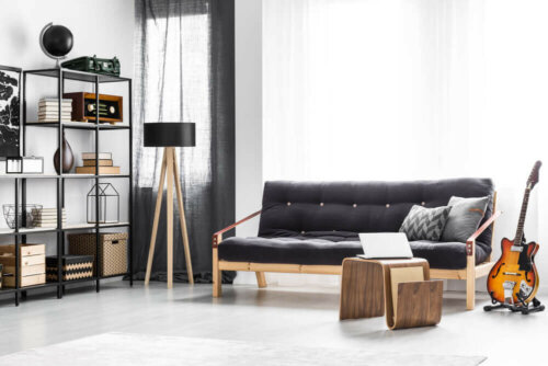 Black sofa in a white living room