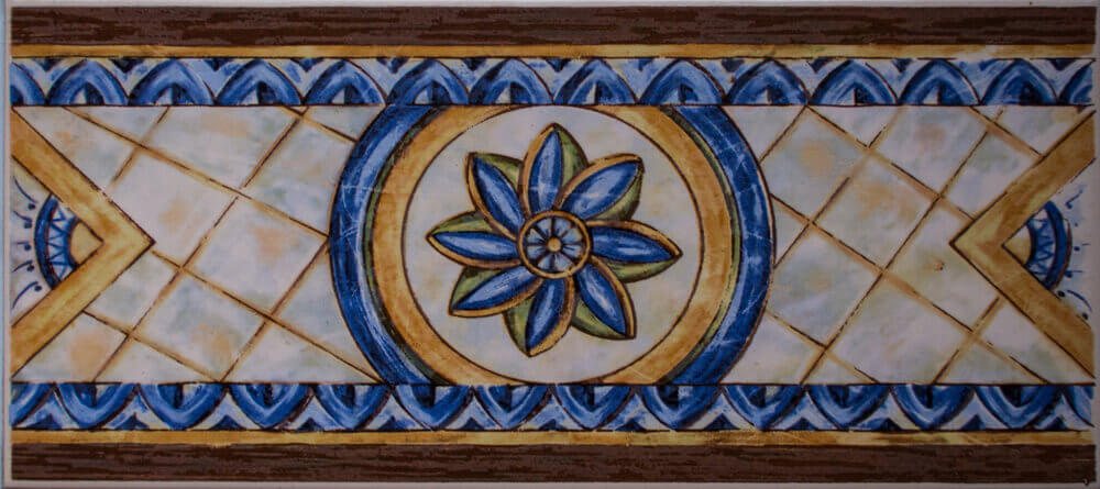 A tile strip featuring a blue flower.