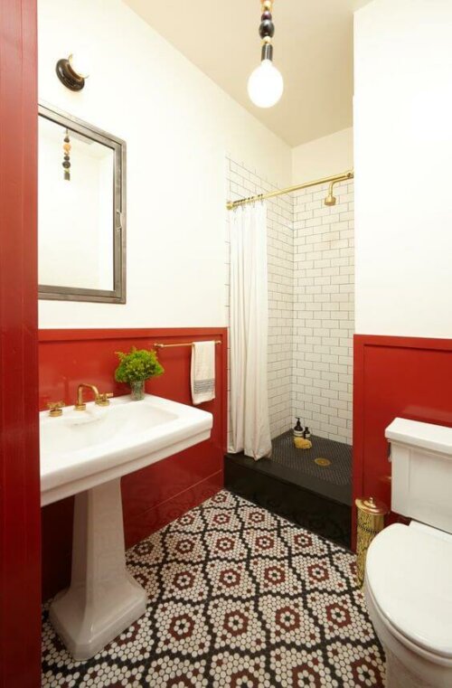 A bathroom with red, black and white.