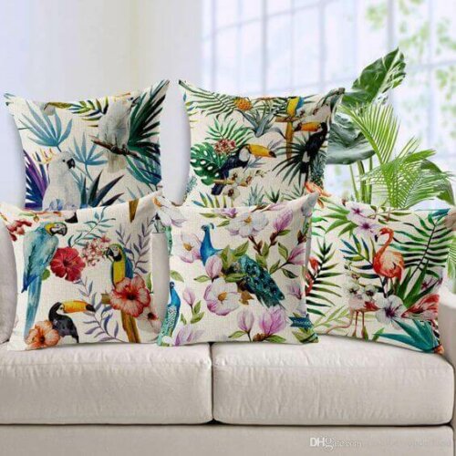 A sofa with colorful cushions.