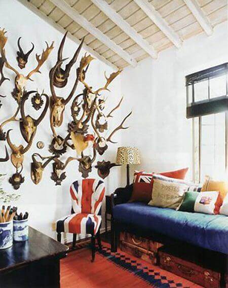 A wall filled with animal heads and skulls