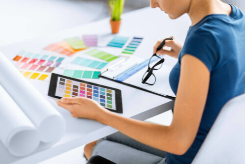A woman checking out different color palettes.