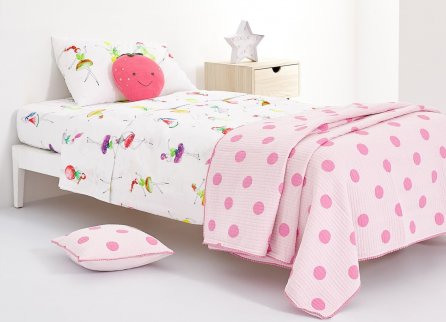 A pink polka dot duvet with fruit themed bedsheets is an original idea for the bedding in a child's room