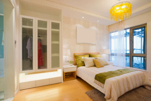 A bedroom with white walls.