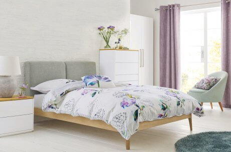 Minimalist bedroom with an original bedding of flowers