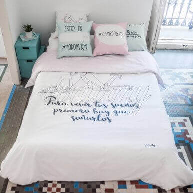 A white duvet with black letter quotes for a modern chic look