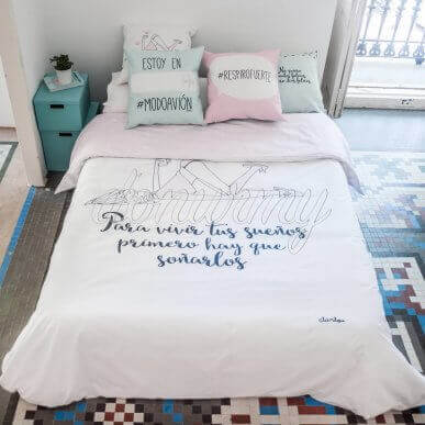 A white duvet with black letter quotes for a modern chic look
