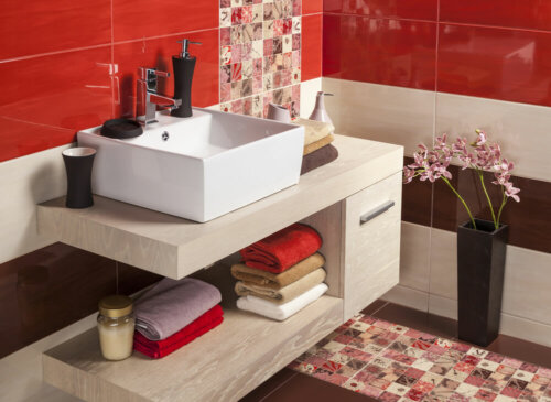 A bright red, tiled bathroom.