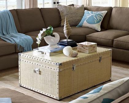 A big trunk used as a table in a living room.