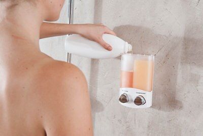 A wall mounted soap dispenser.