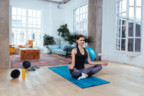 A woman doing yoga at the designated space in her home