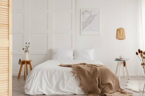 Bedroom with white walls and earth tones