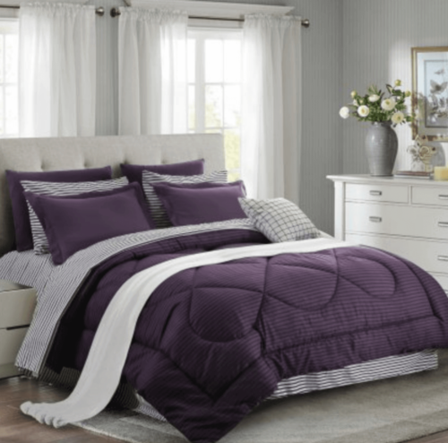 A bedroom with eggplant purple details.