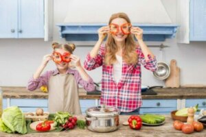A mother and daughter cooking together.