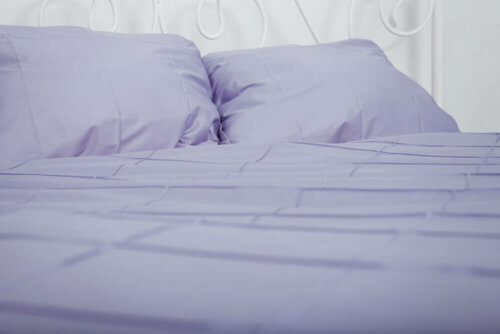 Purple bed sheets.