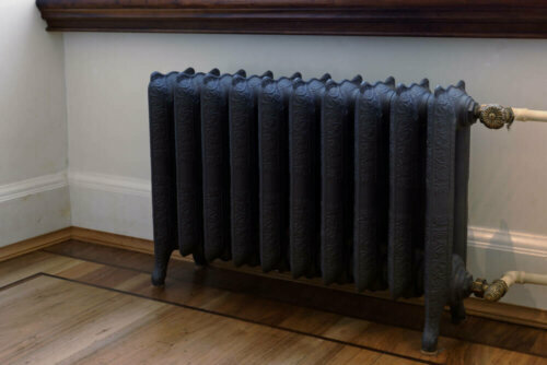 An antique radiator painted black