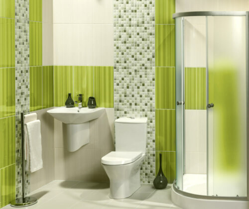 A bathroom with some apple green highlights.