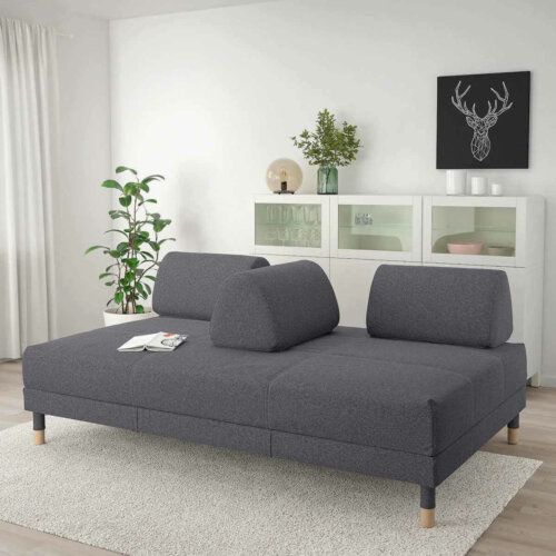 A gray sofa with a detachable back.