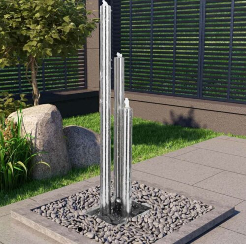 A tall minimalist fountain in a patio.