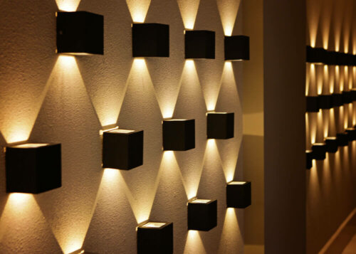 Some lighting on a wall.