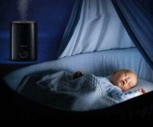 A sleeping baby in a crib.