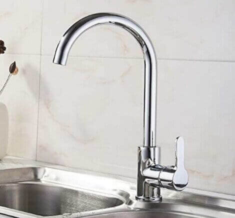 Kitchen sink with a curved faucet