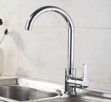 Kitchen sink with a curved faucet