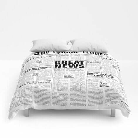 A bedspread the looks like newspaper