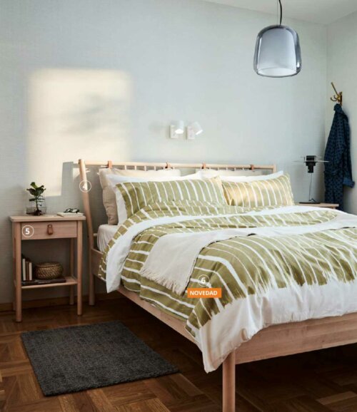 A bedroom with furniture from the IKEA catalogue.